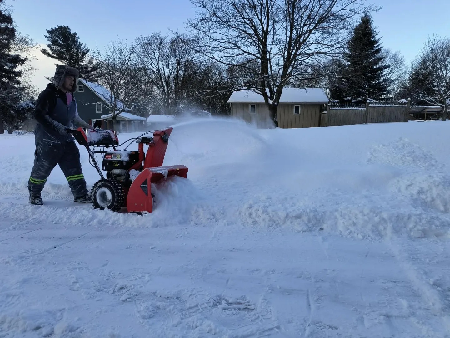 Picture Garden clearing a driveway with a snowblower